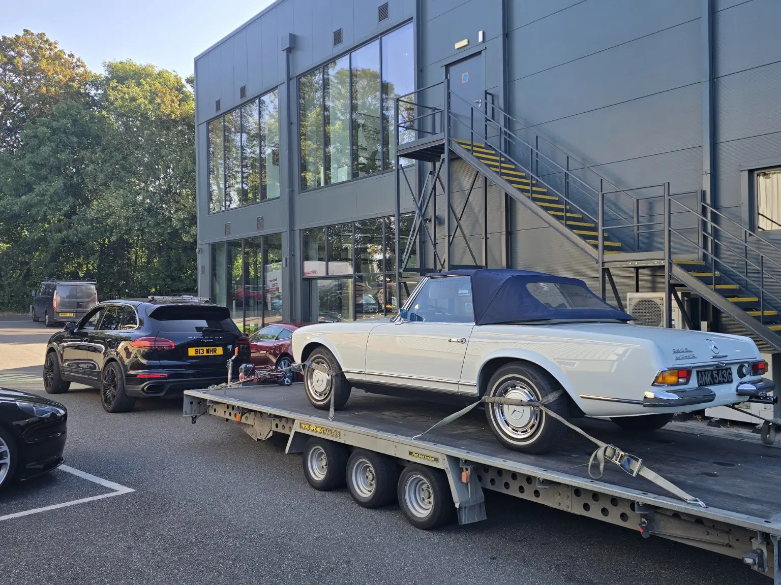 Classic Mercedes secured on a transport trailer