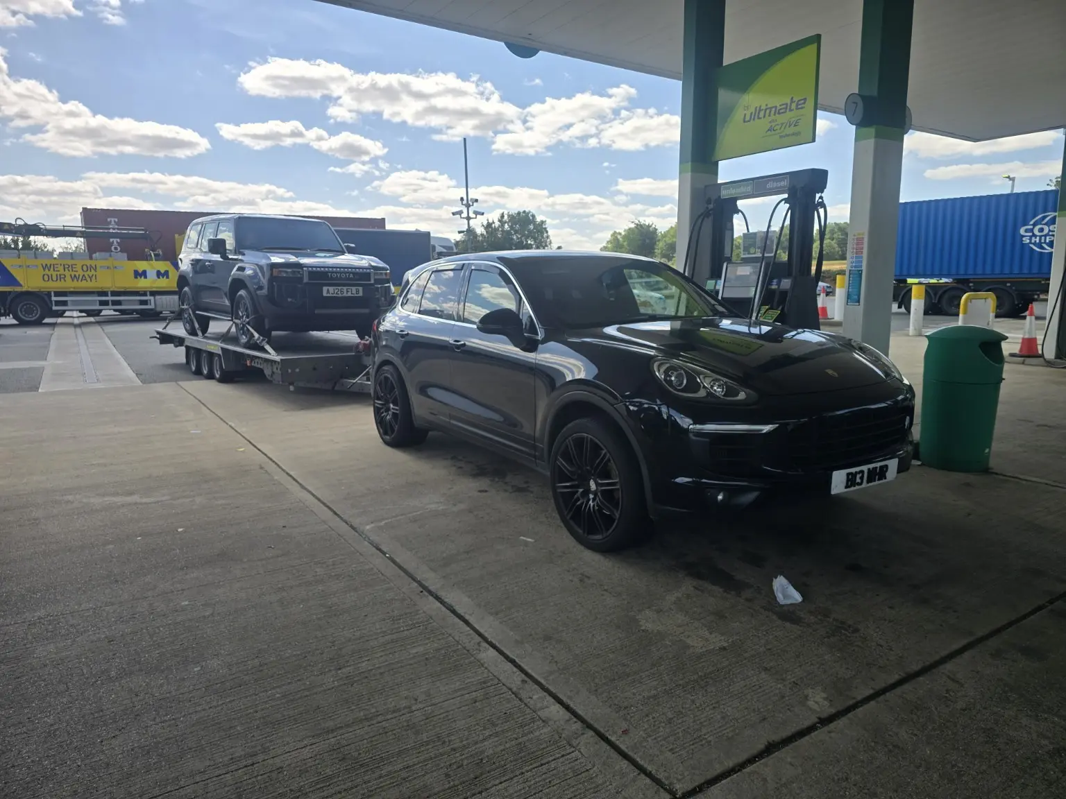 SUV towing an enclosed vehicle trailer